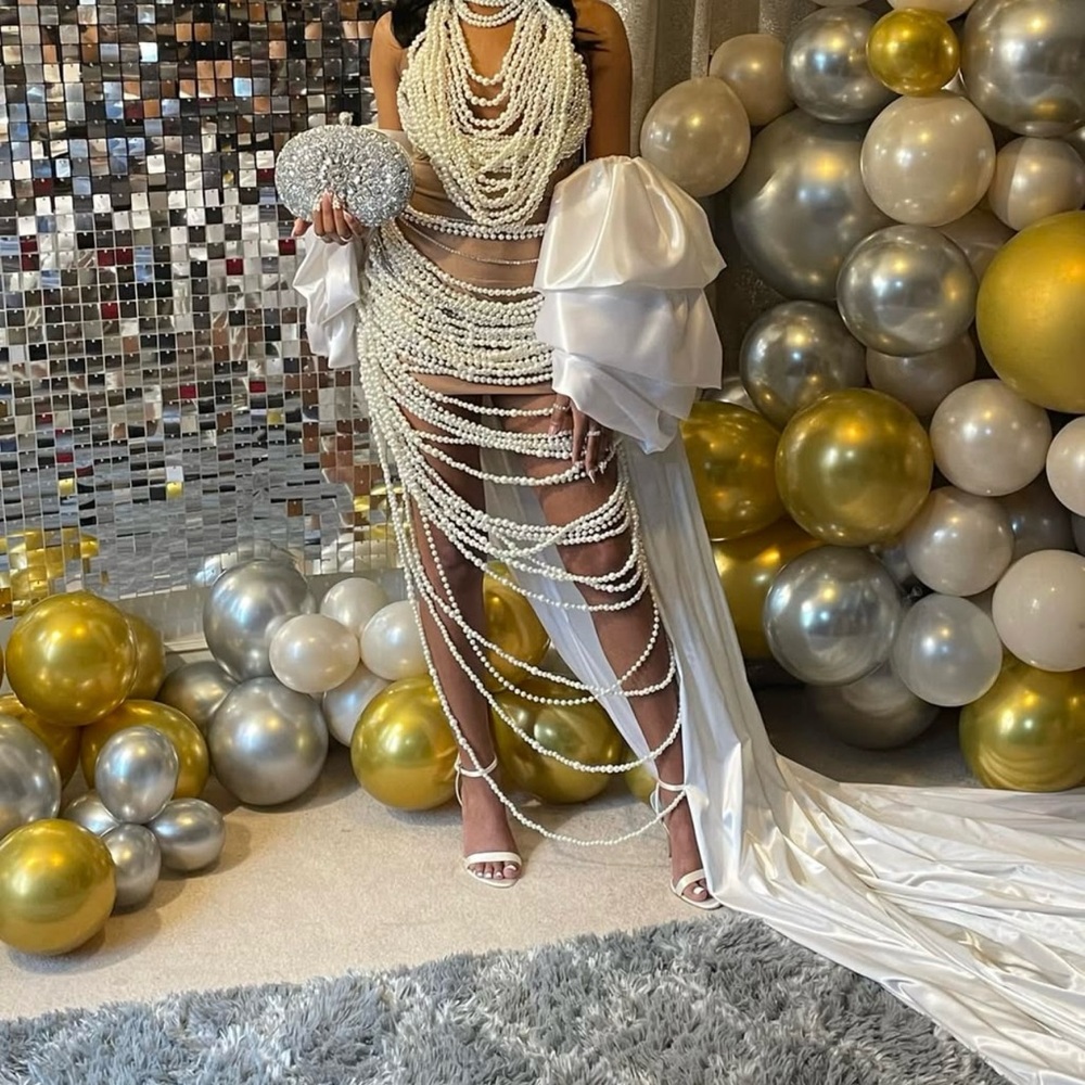 Elegant Pearl and White Gown with Silver Clutch